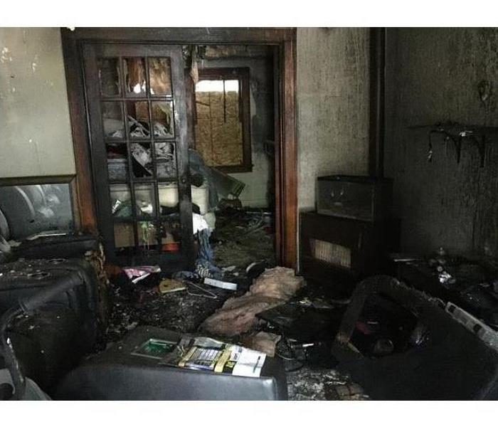 Fire damage in living room home